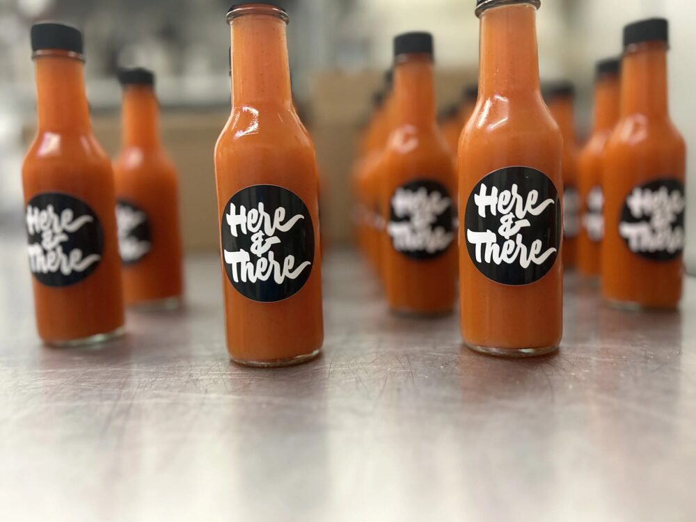 Here & There hot sauce bottles